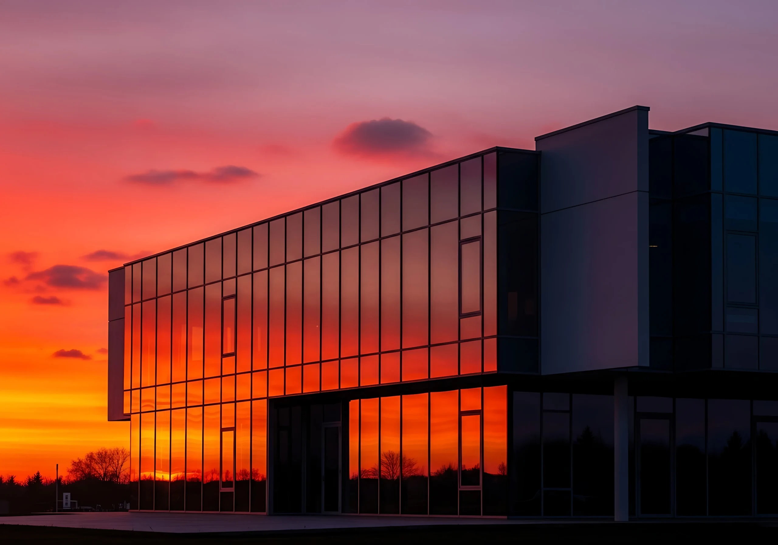 modern architectural beauty reflecting a stunning sunset photo 1